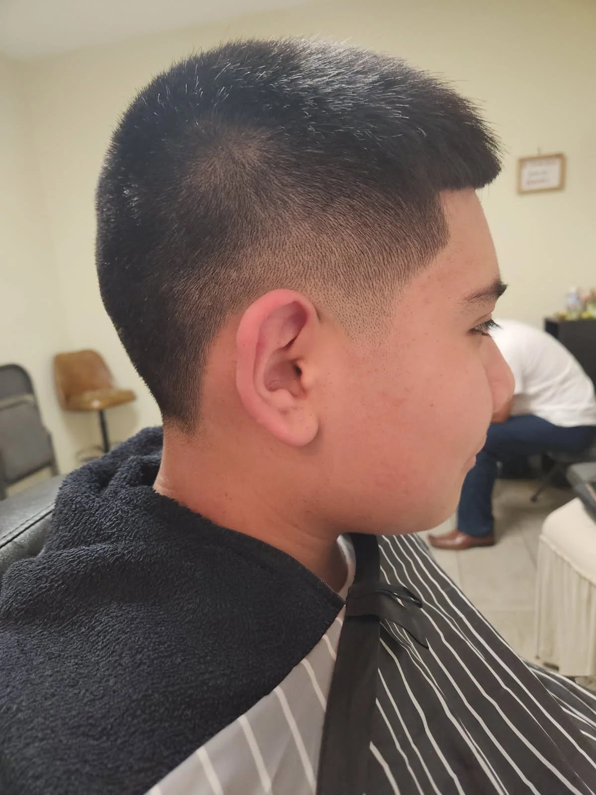 Longer men's haircut side view at Happy Barber