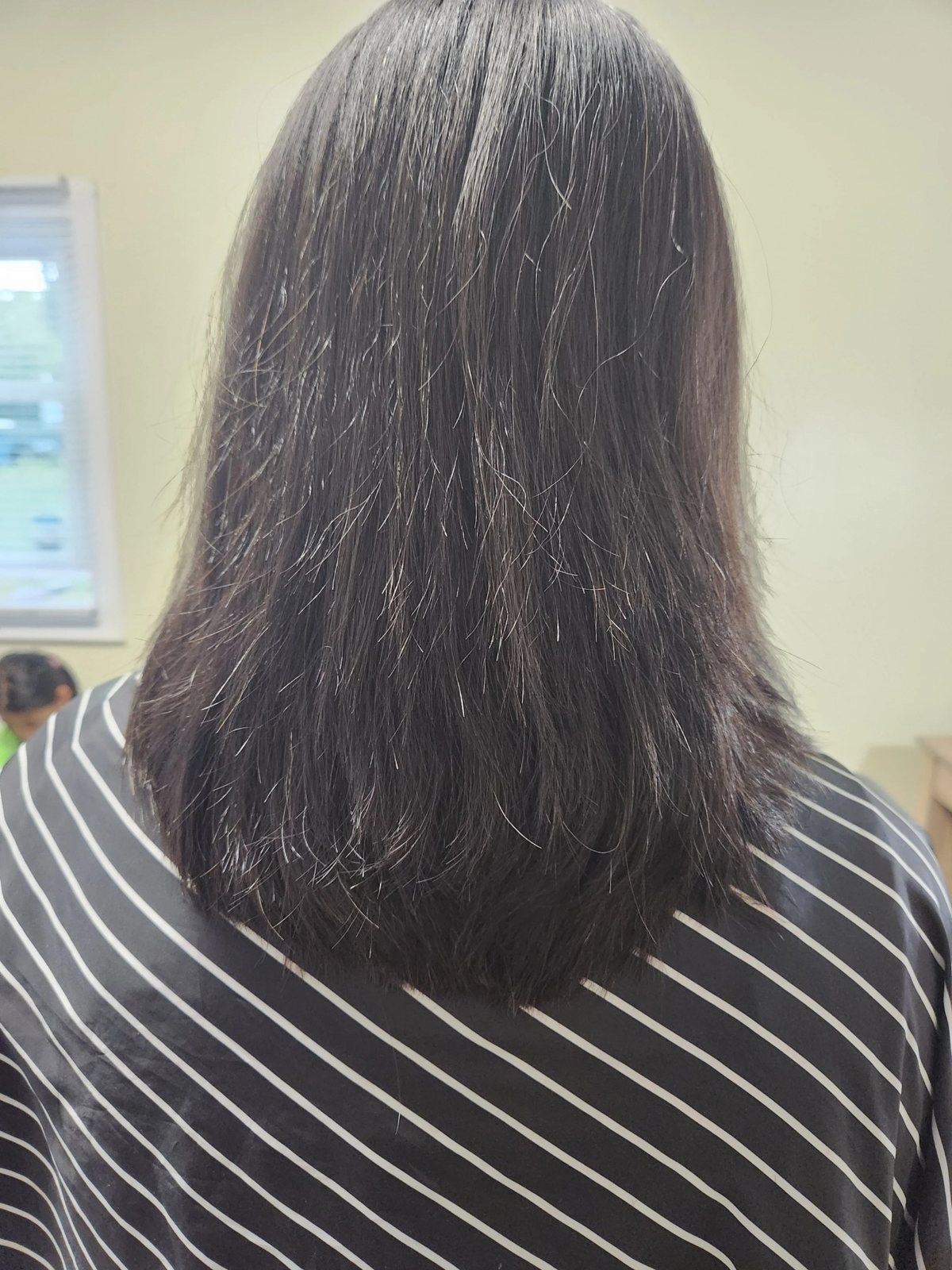 Women's long textured haircut at Happy Barber